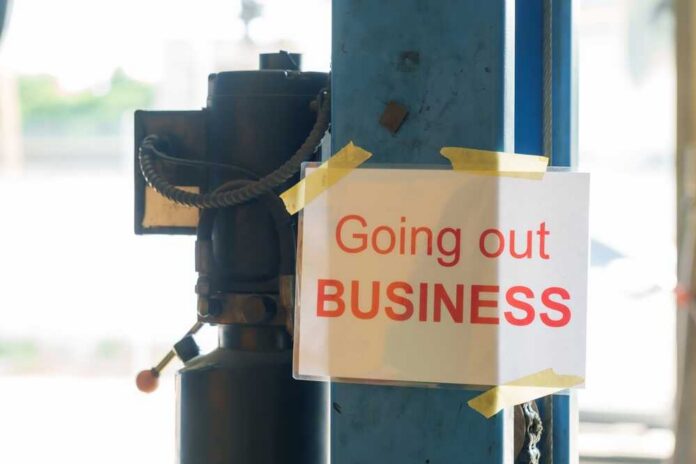 Sign stating 'Going out of Business' attached to a pole