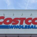 Costco Wholesale store sign against a blue sky