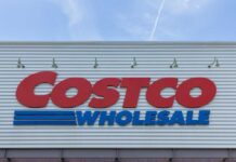 Costco Wholesale store sign against a blue sky