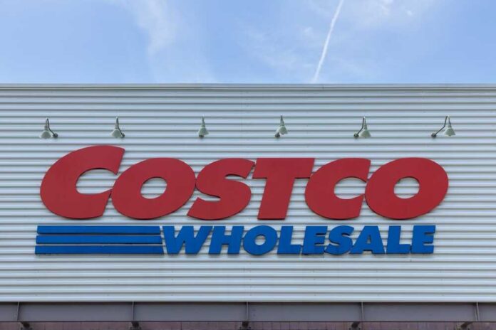 Costco Wholesale store sign against a blue sky