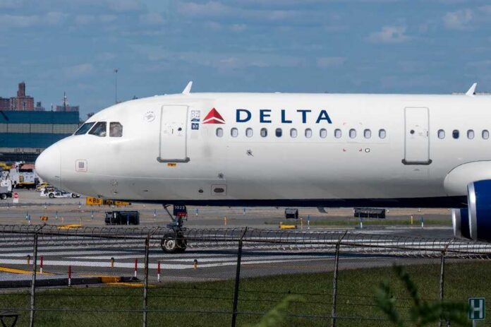 A Delta Airlines airplane on the runway at an airport