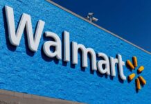 Walmart store sign on a blue wall