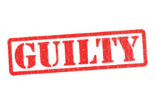 Red stamp with the word guilty inside