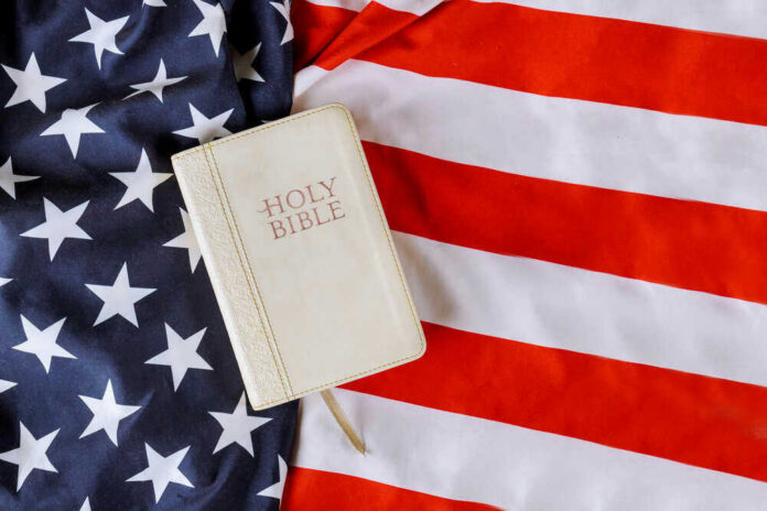 Bible on an American flag background.