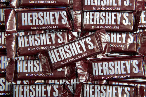 A pile of Hershey's milk chocolate bars stacked together