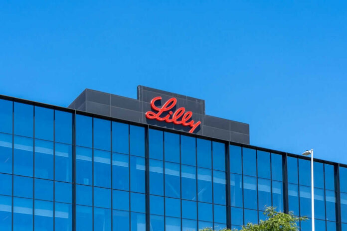 shutterstock_2179444731.jpg Lilly logo on a modern glass building rooftop