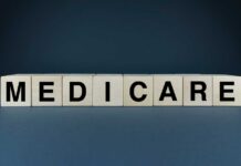 Medicare’s $84 Billion Problem Nobody Can Fix Wooden blocks spelling out MEDICARE on a dark background