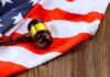 A gavel resting on an American flag