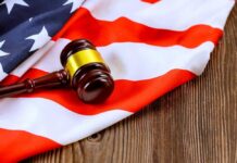 A gavel resting on an American flag