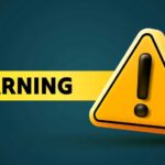CEO Warns Bond Market “Crack” COMING Yellow warning sign with an exclamation mark