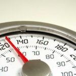 Weight-Loss Shots Linked To Mood Swings? Close-up of an analog bathroom scale display.