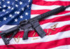 Deadly Vulnerability EXPOSED in US Weapon Systems AR-15 Rifle and bullets on American flag background