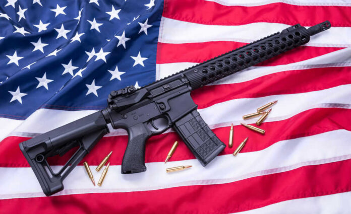 AR-15 Rifle and bullets on American flag background