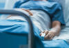 Vanessa Trump’s Bombshell Announcement A patient lying in a hospital bed with a monitoring device in hand