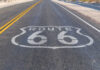 Route 66 highway sign painted on asphalt