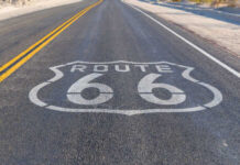 Route 66 highway sign painted on asphalt