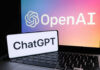 OpenAI ChatGPT logos on laptop and smartphone screens.