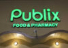 Illuminated Publix Food & Pharmacy sign at night