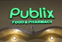 Illuminated Publix Food & Pharmacy sign at night