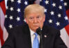 Oval Office Brawl Shakes Israel Strategy? Donald Trump speaking with American flags in background.