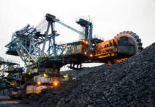 Large mining machinery operating in a coal mine