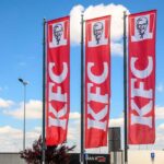 Chicken Wars Escalate: KFC’s Wild Reboot KFC restaurant sign against a blue sky
