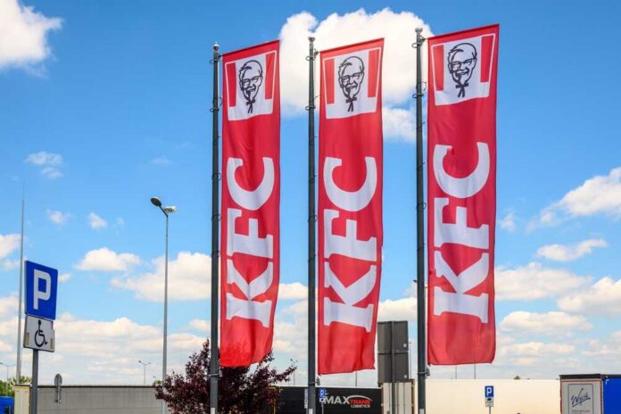 KFC restaurant sign against a blue sky