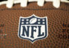 NFL Star Dead at 36 — No Answers Close-up of NFL logo on American football.
