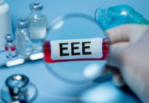 Ebola Numbers Lie — What’s Really Spreading? Magnifying glass over test tube labeled EEE