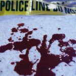 UPDATE: Graduation Ceremony Turns Deadly Blood stains on a surface with police caution tape in the background