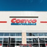 Costco’s Price Play Revealed Exterior view of a Costco Wholesale store with shopping carts in front