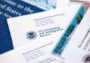 Supreme Court Greenlights Border Turnbacks USCIS documents and a green card on a table