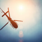 VIDEO: Deadly Fireball As Two Copters Collide A helicopter flying against a bright sky