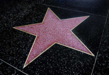 Beloved Buffy Mentor Gone — Fans Stunned A red star embedded in a black sidewalk, part of the Hollywood Walk of Fame