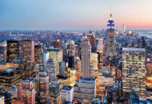 Empire Spire Stunt Turns Felony New York City skyline at dusk with skyscrapers.