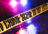 NFL Family Horror Inside Suburban Home Crime scene tape with flashing lights in background.