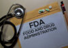 Bosses Bet Big on Ozempic Stethoscope and medication on a folder labeled FDA