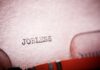 Hidden Labor Crash Alarms Markets Close-up of a typewriter with the word 'JOBLESS' typed on paper