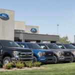 Ford dealership with trucks lined up outside