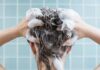 Person washing hair with shampoo lather