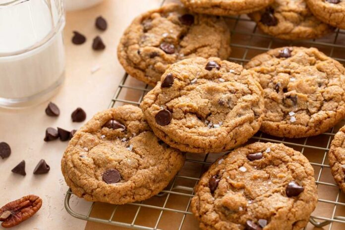 Chocolate,Chip,Cookies,With,Pecan,Nuts,,Freshly,Baked,Cookies,On A shopping cart filled with fresh fruits, vegetables, and groceries