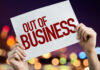 Pizza Chain Bloodbath: 50 Stores Axed Hands holding an out of business sign