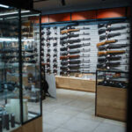 Texas Judge Guts NFA Power Interior of a gun shop showcasing various firearms on display
