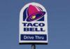 Taco Bell drive-thru sign against a clear blue sky