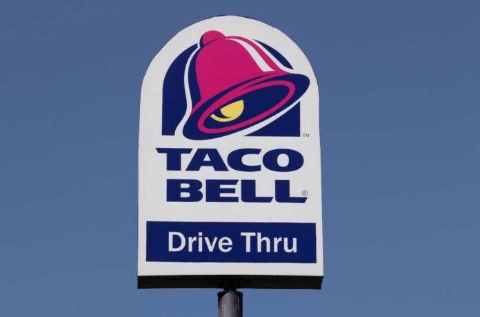 Indianapolis,-,Circa,August,2022:,Taco,Bell,Fast,Food,Restaurant. Taco Bell drive-thru sign against a clear blue sky
