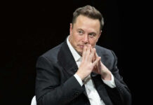 Musk’s $100M Midterm Gambit Elon Musk in suit thinking.