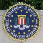 FBI Drops Bombshell On China Hack Crew FBI seal featuring stars and laurel leaves