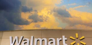 Walmart sign against a cloudy sky