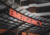 Lightning Slams Prison — 16 Rushed To Hospitals Illuminated emergency sign at a hospital entrance