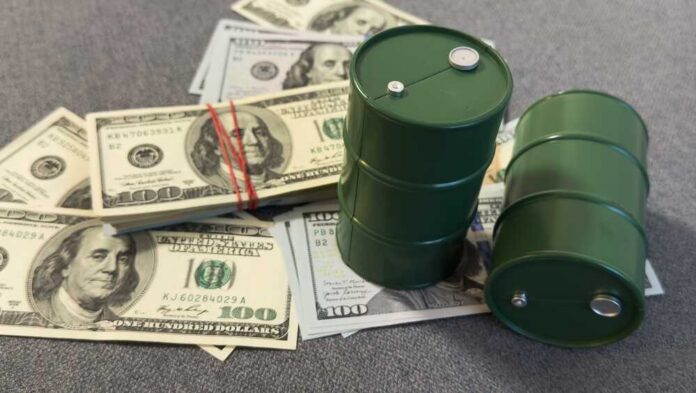 Green oil barrels on US dollar bills